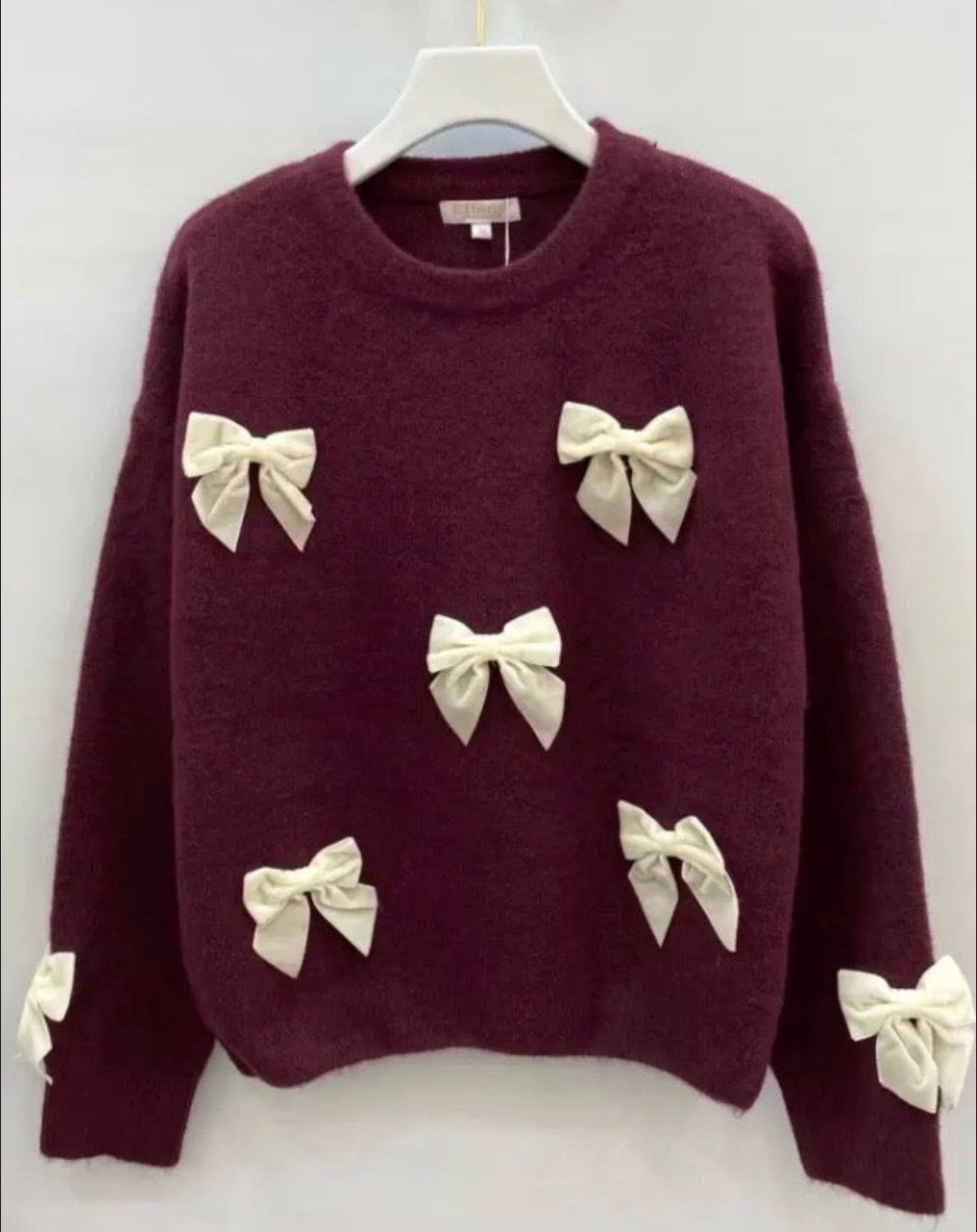 Sweaters met strikjes