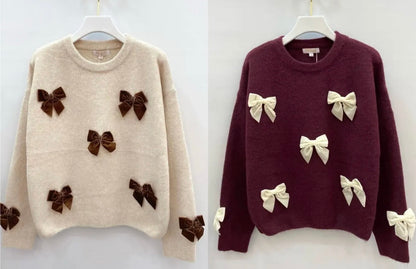 Sweaters met strikjes
