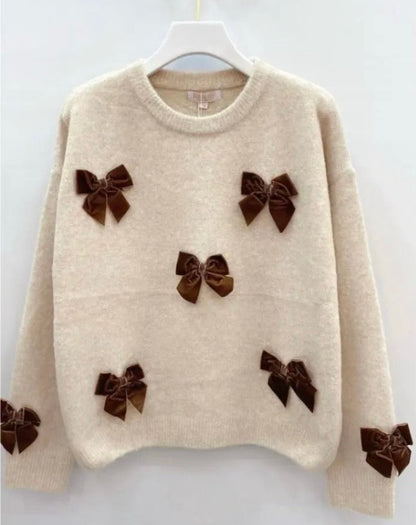 Sweaters met strikjes